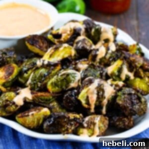 A vibrant image of crispy Bang Bang Brussels Sprouts.