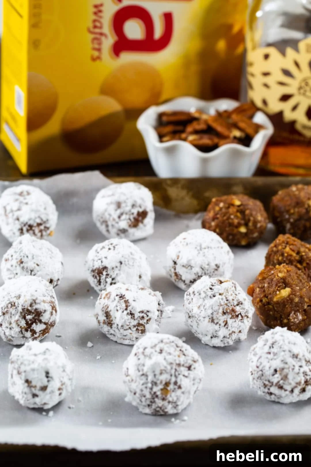Close-up of Vanilla Wafer Bourbon Balls coated generously in powdered sugar, ready to be served.