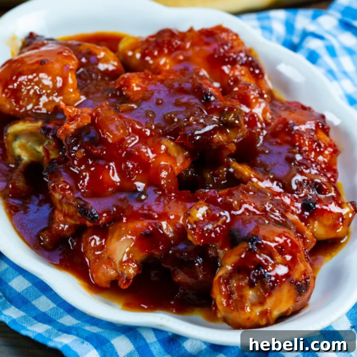 Delicious Baked Apricot Chicken served on a plate, garnished with fresh herbs.