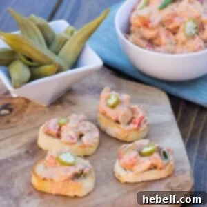 Creamy crawfish spread featuring tender crawfish and pickled okra, prepared for serving.