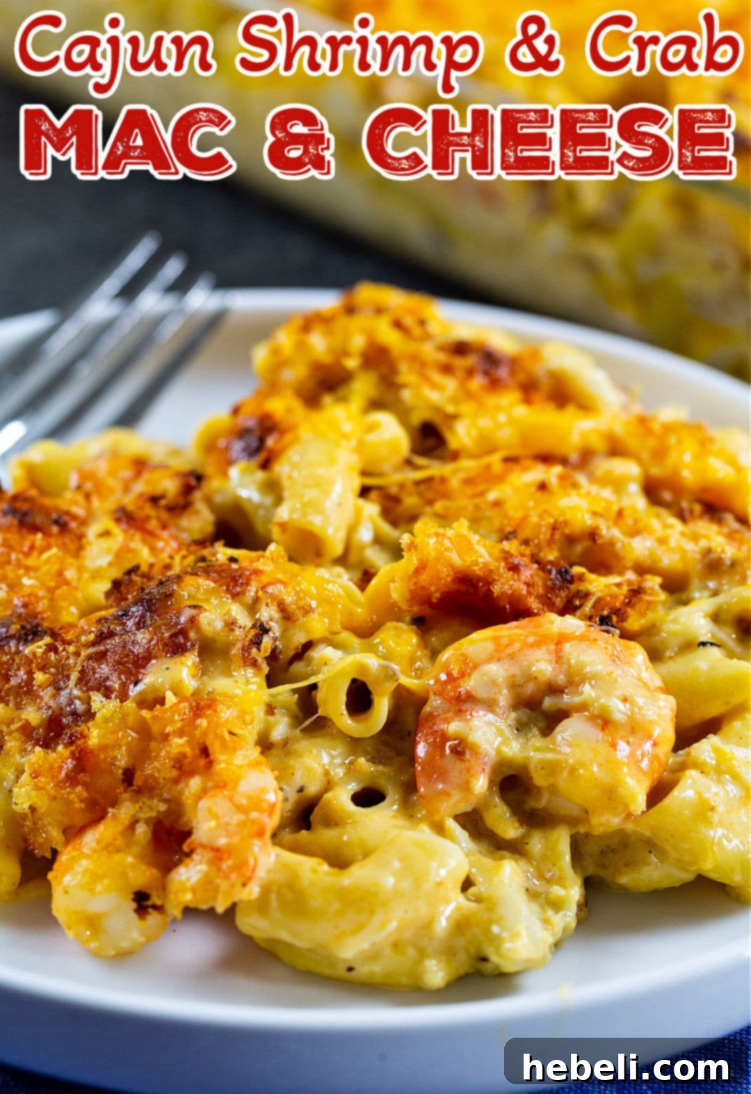 Plated serving of Cajun Shrimp and Crab Mac and Cheese, garnished with fresh herbs, ready to be enjoyed.