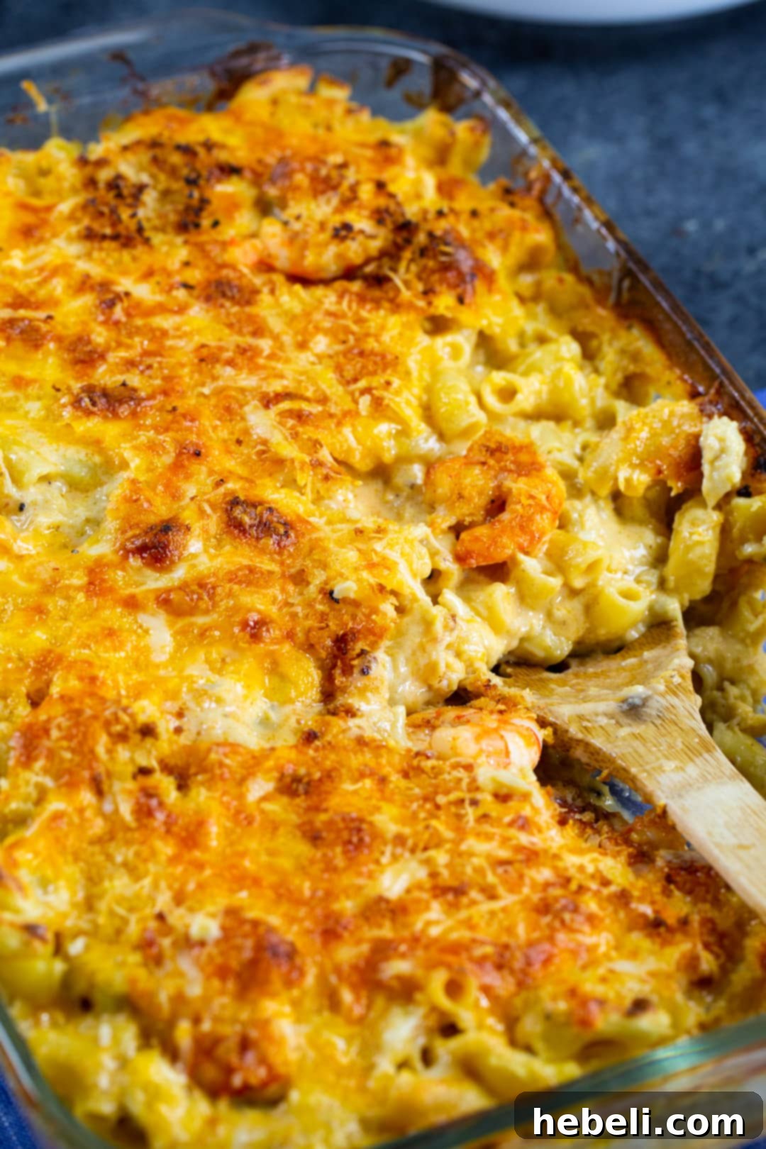 Large baking dish filled with bubbling Cajun Shrimp and Crab Mac and Cheese, topped with golden crumbs.