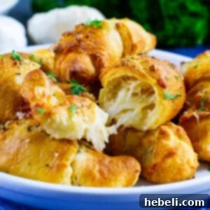 Delicious Air Fryer Cheesy Garlic Crescent Rolls, golden and ready to eat.