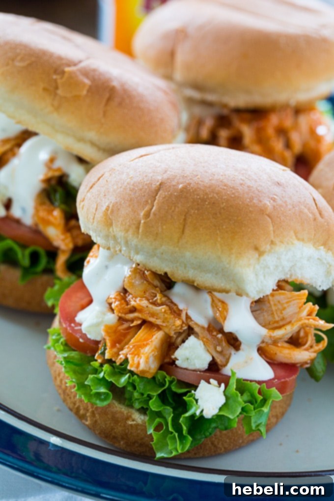 Mini Buffalo Chicken Sandwiches 4 Juicy Buffalo Chicken Sliders piled high with fresh toppings like lettuce, tomato, blue cheese, and ranch.