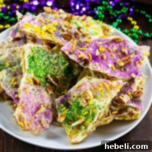 King Cake Toffee Bark 6 King Cake Cracker Candy pieces ready to be served.