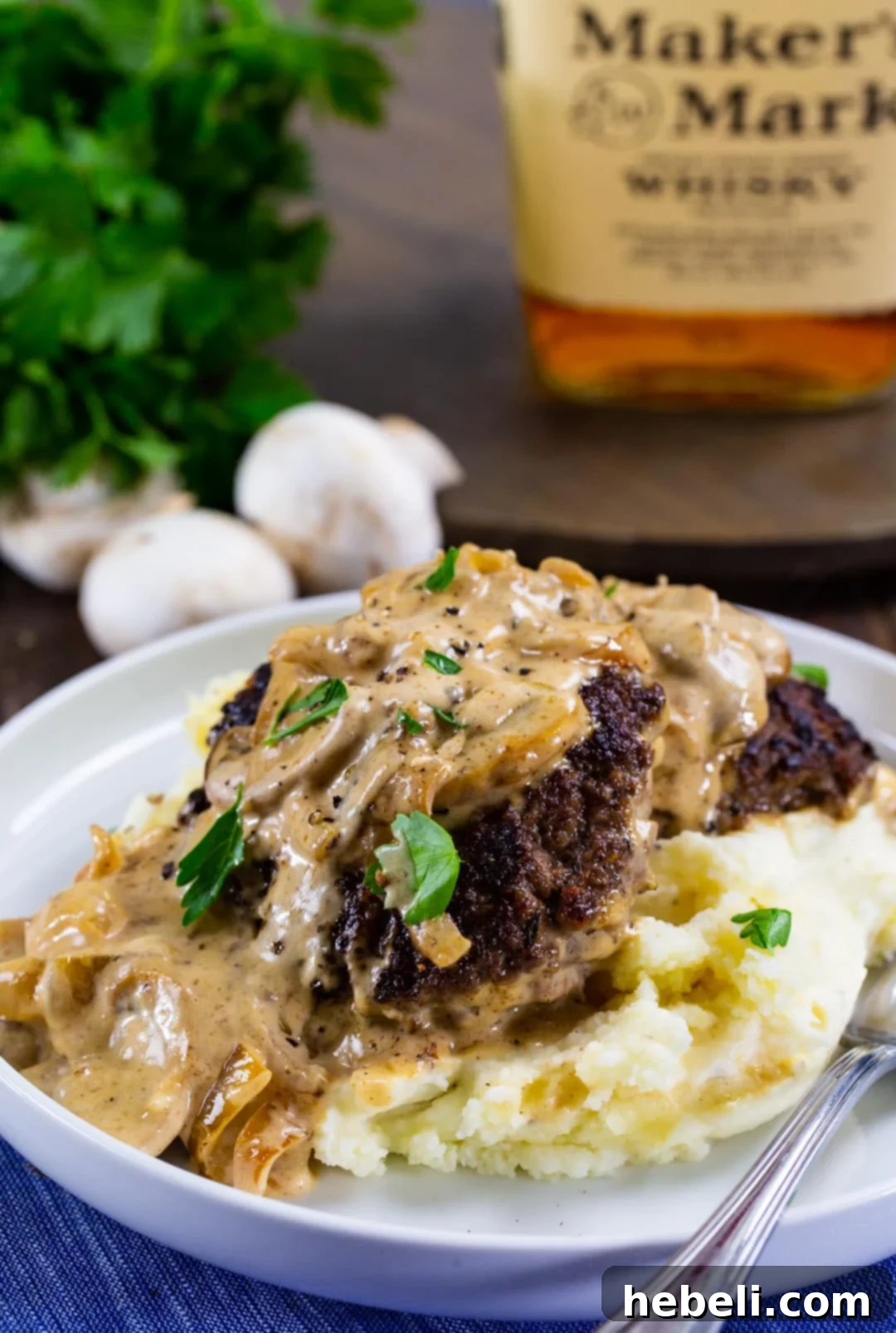 Bourbon Mushroom Gravy Hamburger Steaks 5 Hamburger Steaks with Bourbon Mushroom Gravy served over creamy mashed potatoes.