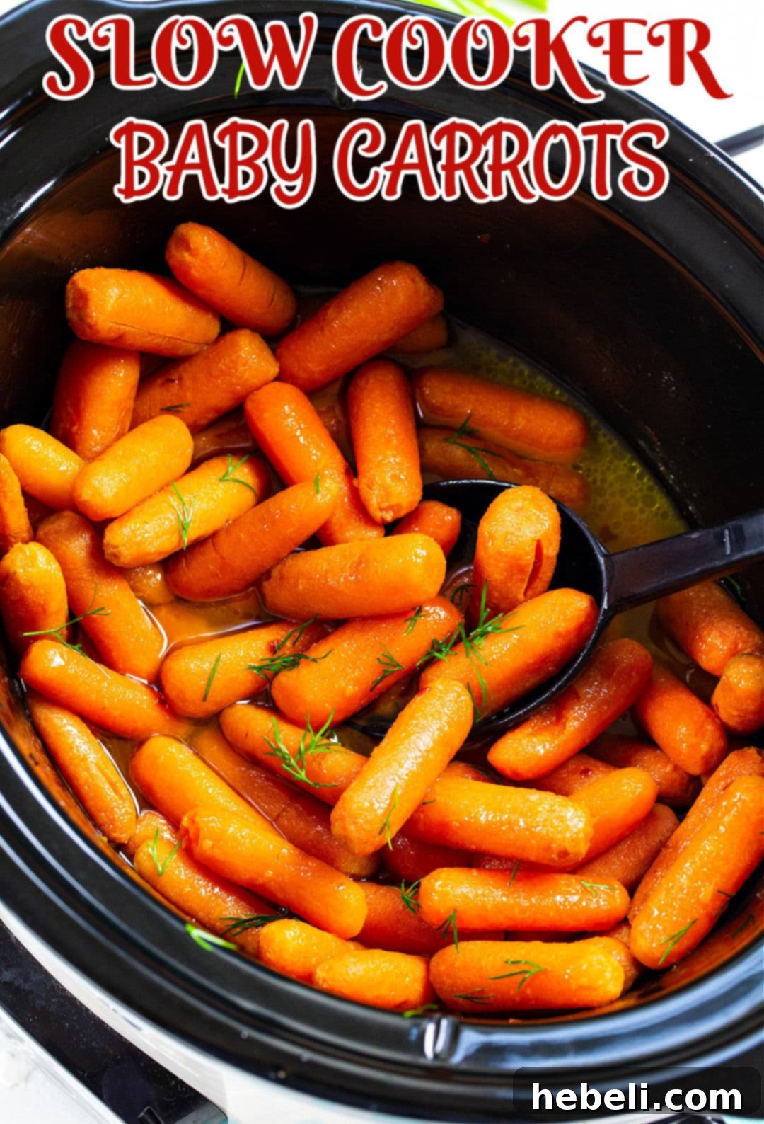 Spoon scooping glazed carrots out of slow cooker, ready to serve.