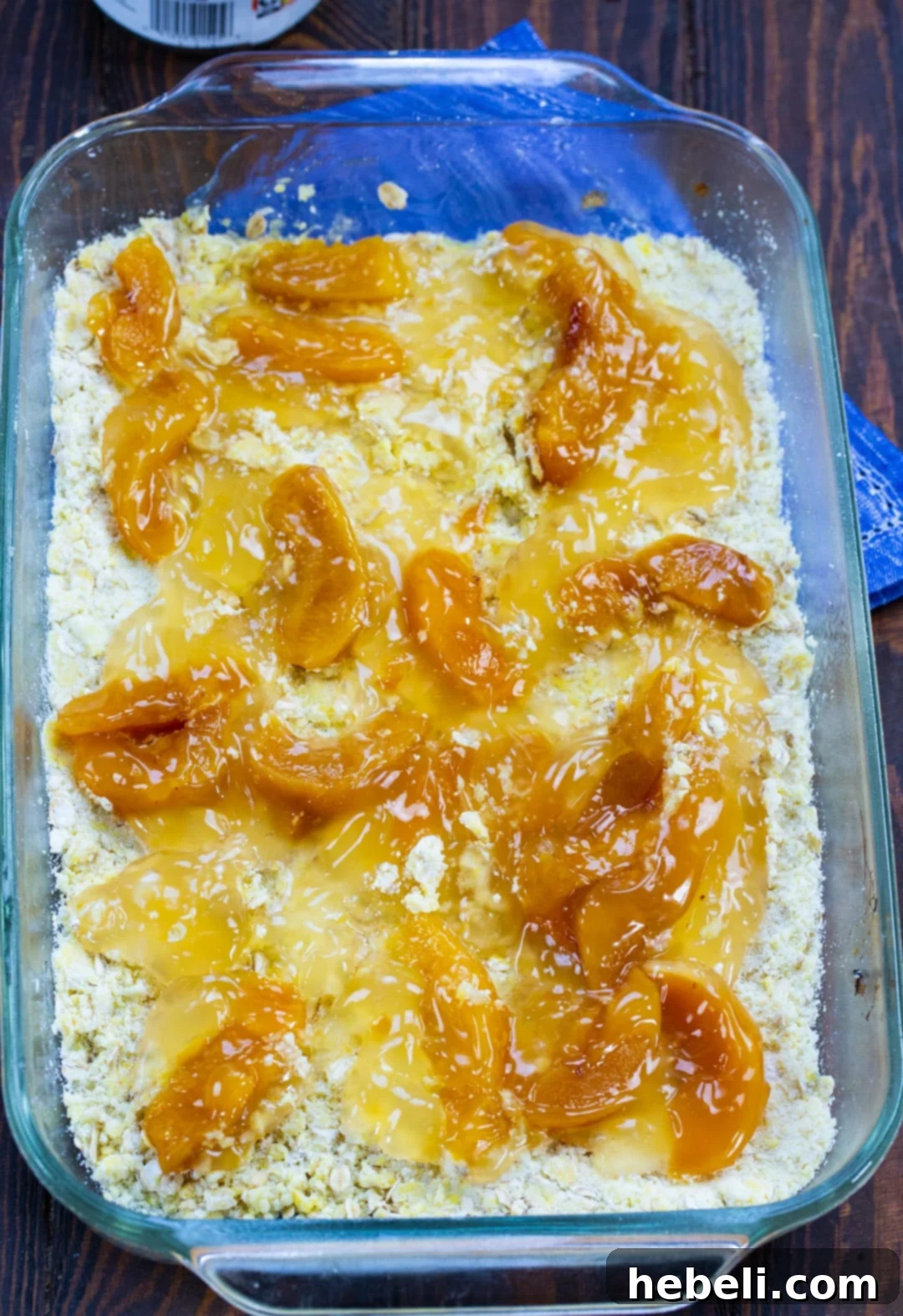 Sweet peach pie filling generously spread over the golden oat crust base.