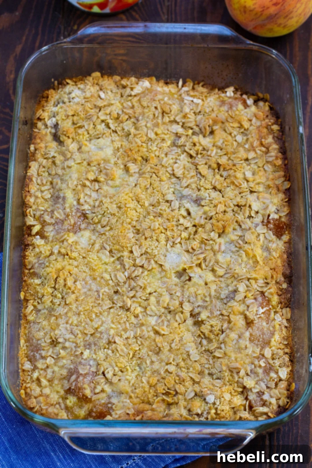 Freshly baked peach bars, golden brown and bubbling, straight out of the oven.