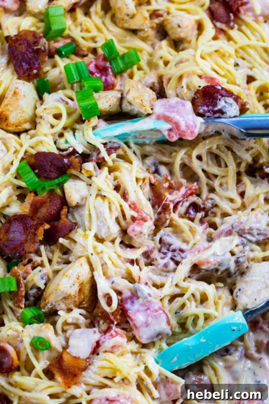Close-up of Creamy Angel Hair Pasta, showcasing the blend of ingredients, creamy sauce, and chicken pieces.