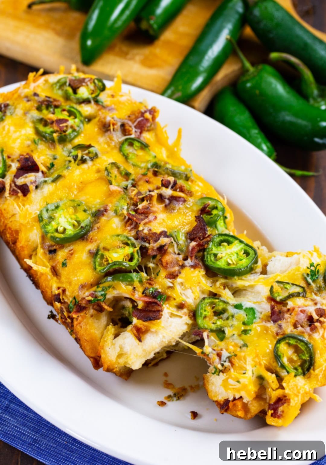 Spicy Cheesy Pull-Apart Perfection 6 A freshly baked loaf of Jalapeno Cheese Pull-Apart Bread on a serving plate.