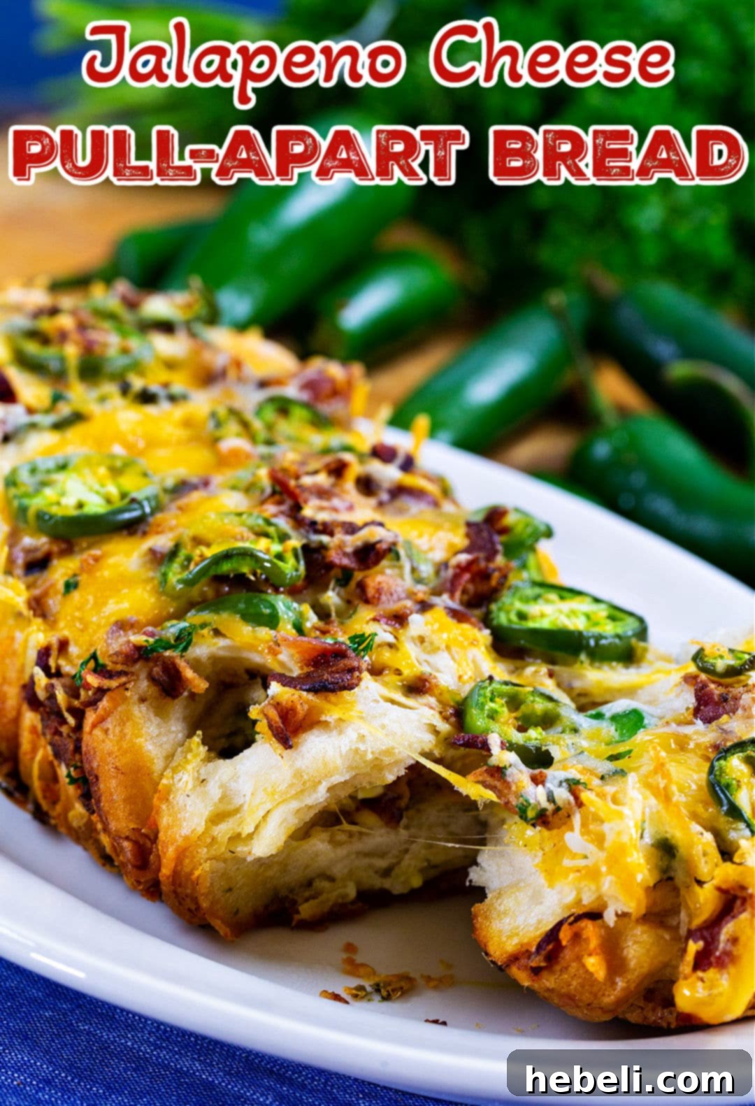 Spicy Cheesy Pull-Apart Perfection 7 A slice of Jalapeno Cheese Pull-Apart Bread on a serving plate, showing the cheesy layers.