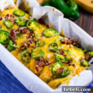Jalapeno Cheese Pull-Apart Bread with a slice removed, showing layers.