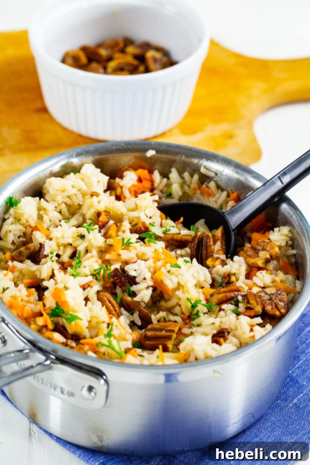 Pecan Rice Pilaf 3 Rice Pilaf with toasted pecans in a pot, garnished with fresh parsley.