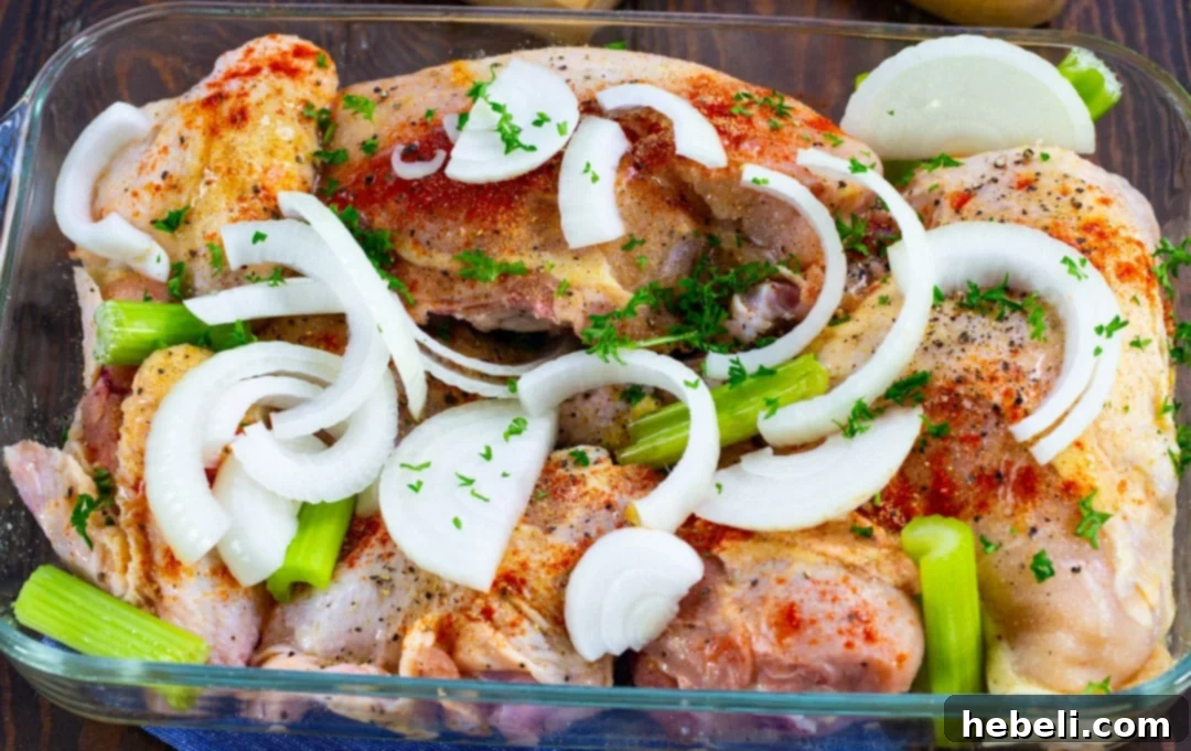 Classic Southern Baked Chicken 3 Uncooked chicken pieces meticulously arranged in a baking dish, ready for seasoning and baking.