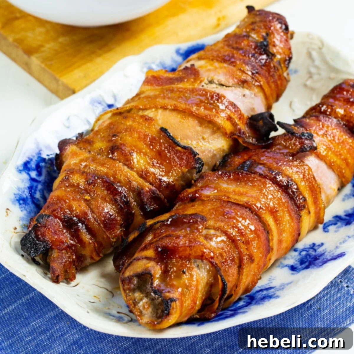 Beautifully plated Brown Sugar Bacon Wrapped Pork Tenderloin, ready to serve.