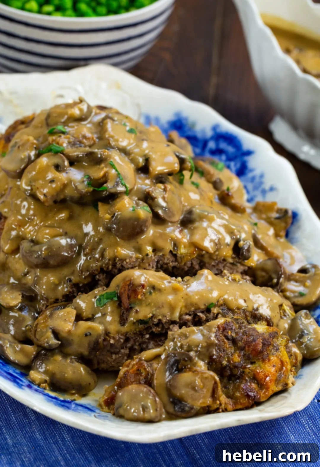 Close-up of a meatloaf slice, showing its moist texture and savory composition.
