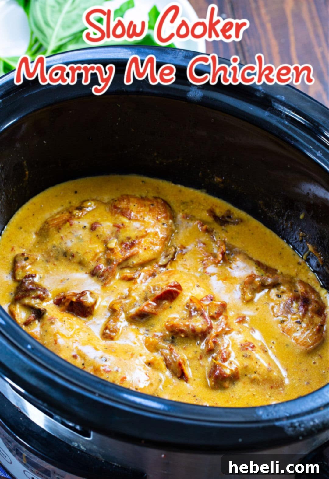 Slow Cooker Engagement Chicken 3 Marry Me Chicken simmering in a slow cooker, showcasing the creamy sun-dried tomato sauce.