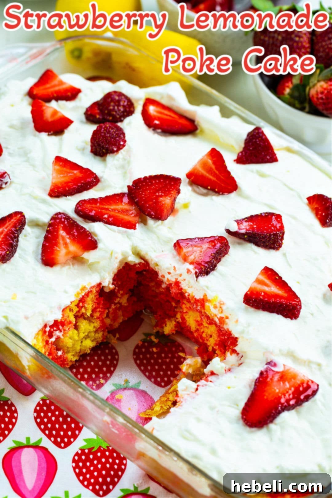 An overhead shot of the complete Strawberry Lemonade Poke Cake in its baking dish, adorned with fresh strawberries, ready to be served.