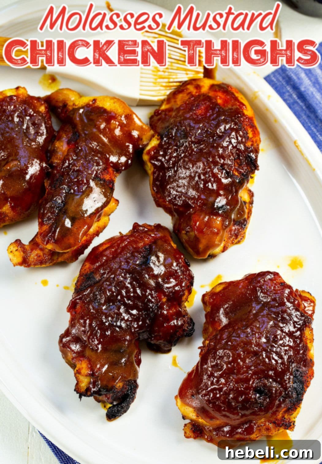Molasses Mustard Glazed Chicken Thighs 5 Close-up of cooked Molasses Mustard Chicken Thighs on a serving plate, glazed and ready to eat.