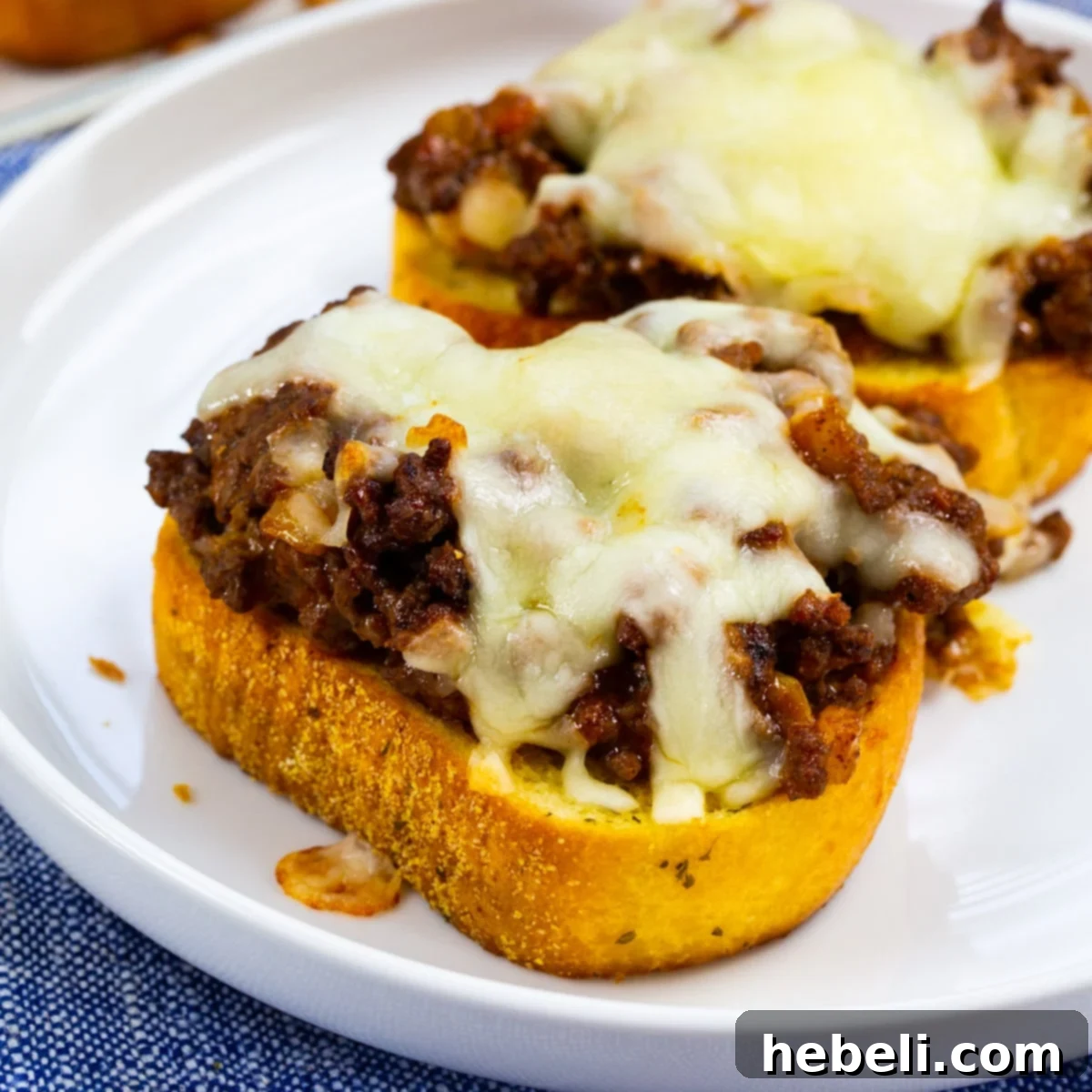 Loaded Texas Toast Sloppy Joes 2 Texas Toast Sloppy Joes on a plate, ready to be enjoyed.