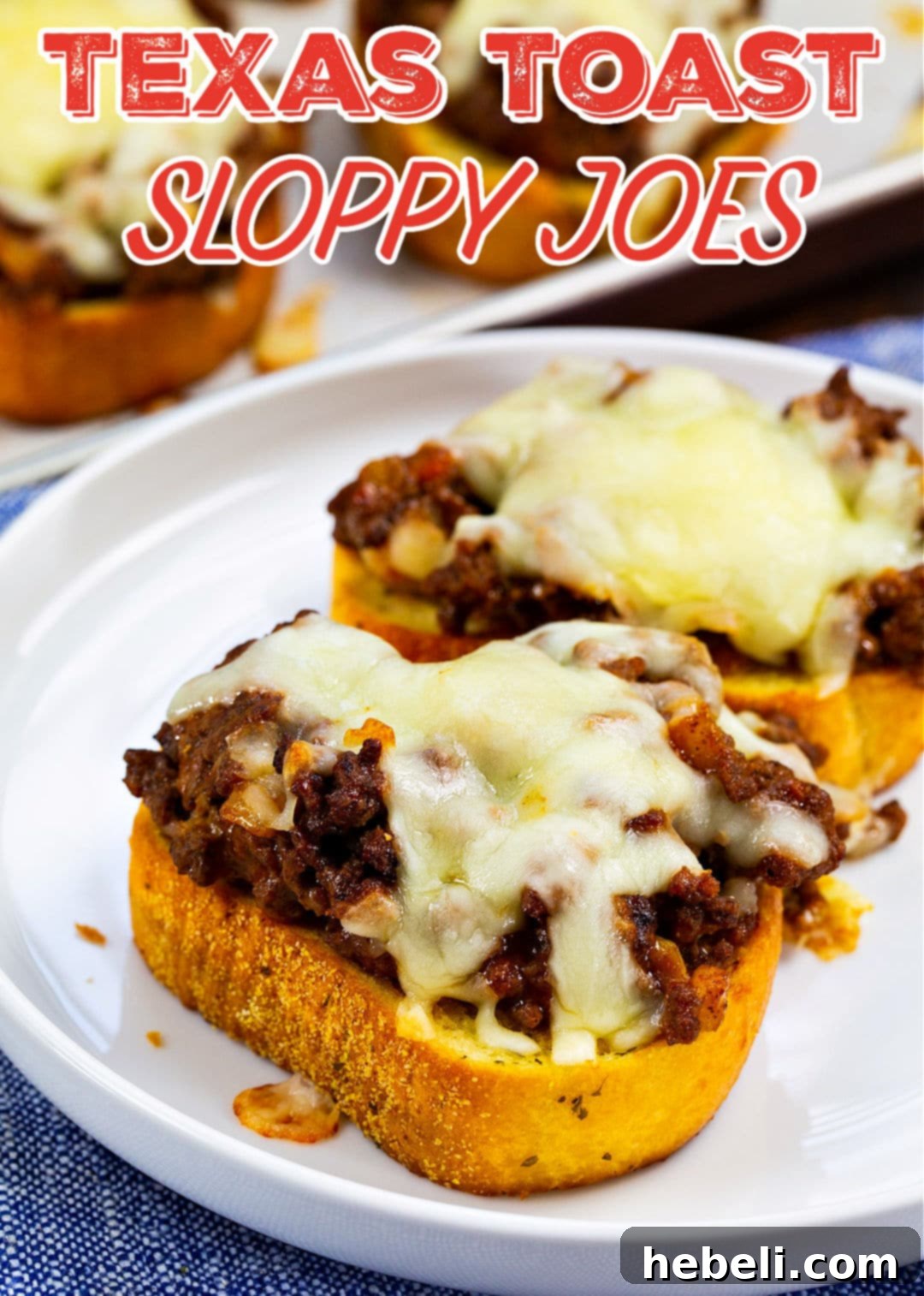Loaded Texas Toast Sloppy Joes 6 A close-up of a finished Texas Toast Sloppy Joe on a plate, showing the melted cheese and hearty mixture.
