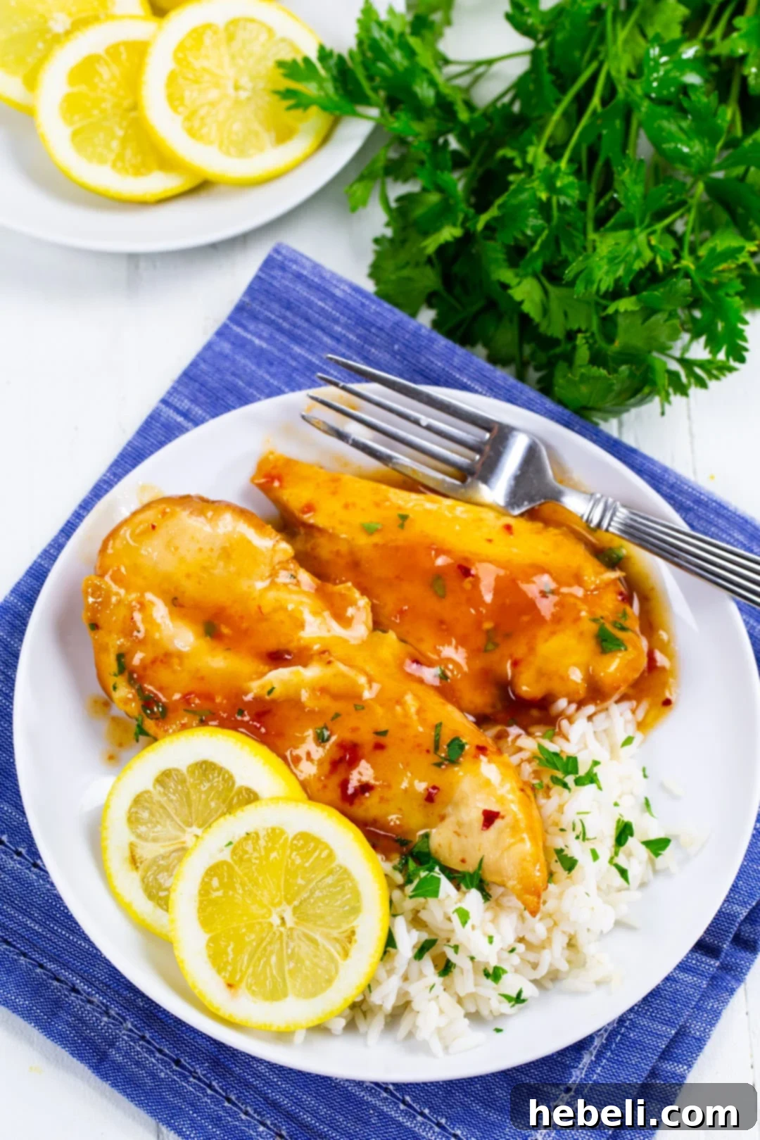 Zesty Slow Cooker Lemonade Chicken 4 Slow Cooker Lemonade Chicken on plate with rice.