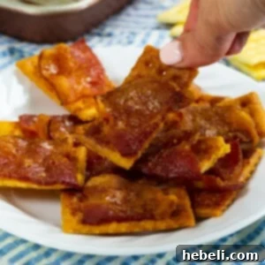 Sweet & Spicy Bacon Bites 6 Spicy Candied Bacon Crackers on a plate.