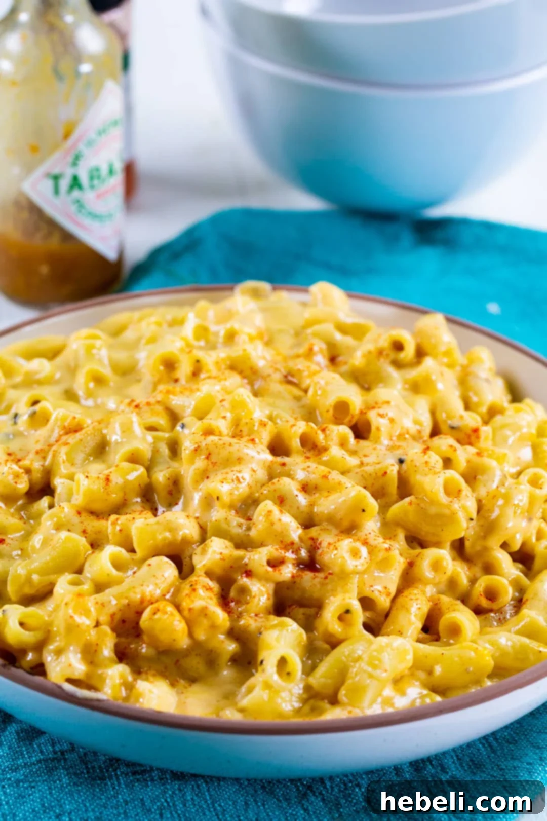 A bowl of Spicy Mac and Cheese, garnished and ready to enjoy.