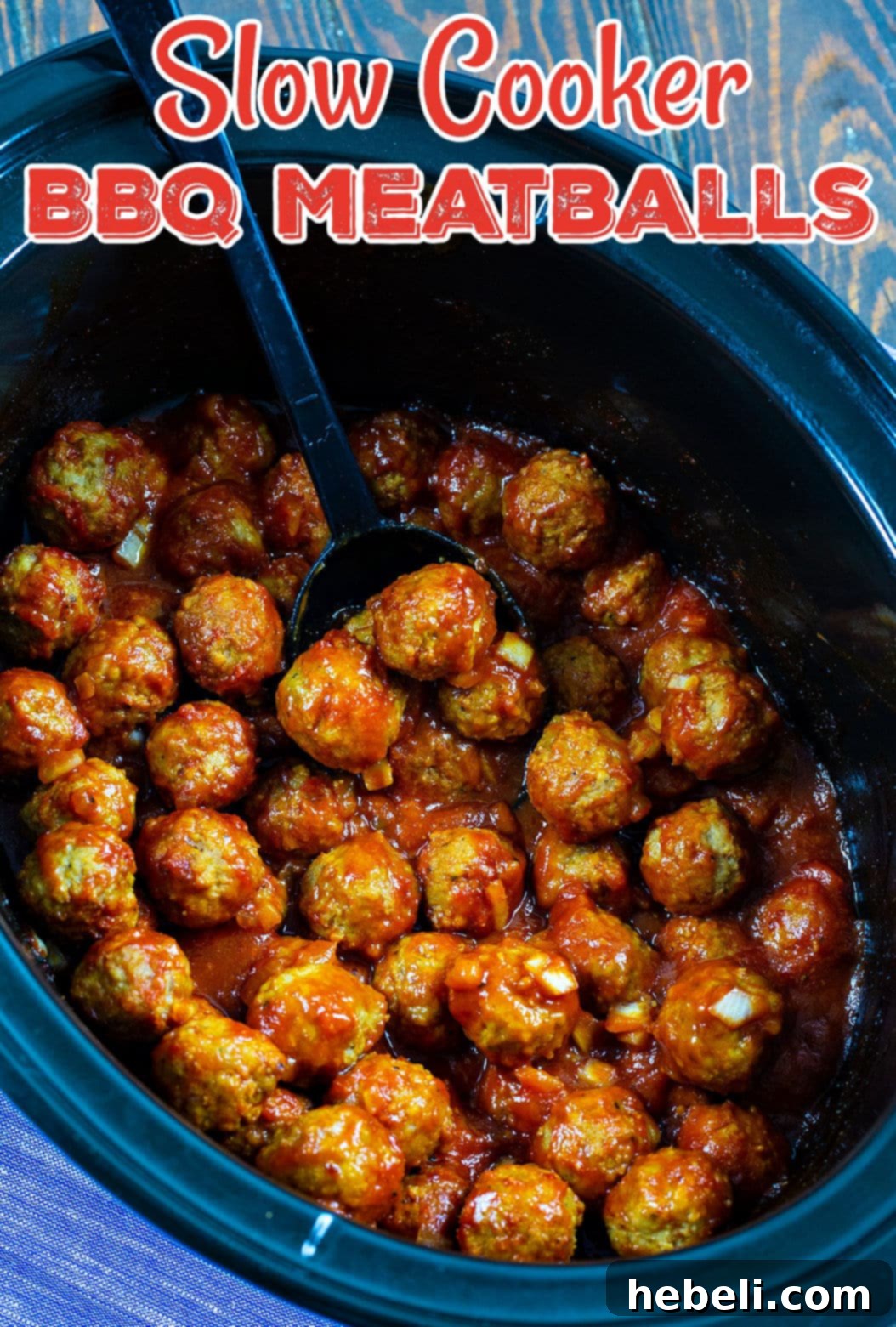 Tender Slow Cooker BBQ Meatballs 4 An overhead shot of BBQ Meatballs in a slow cooker, showcasing the rich, dark sauce.