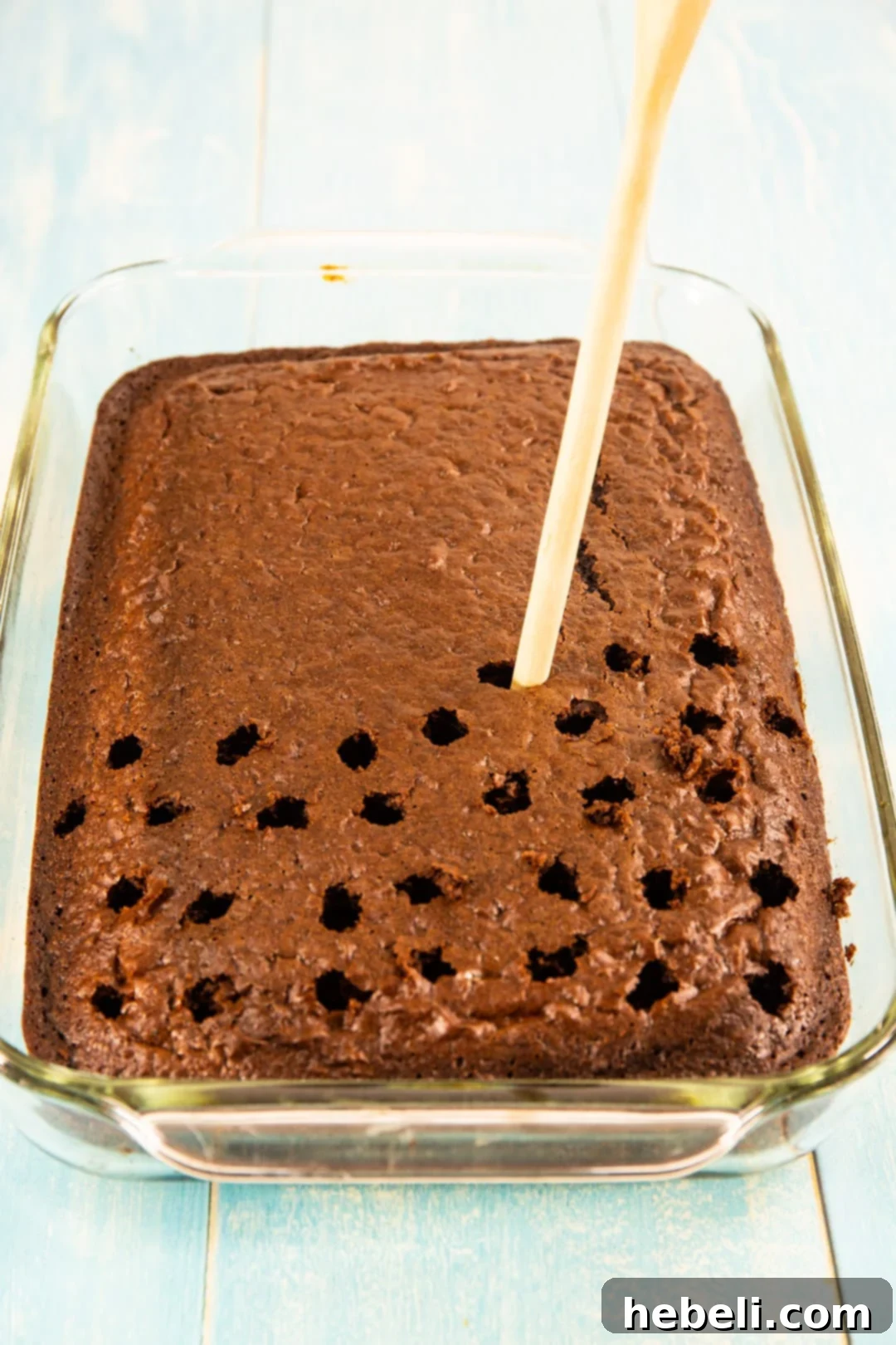 Holes getting poked in cake.