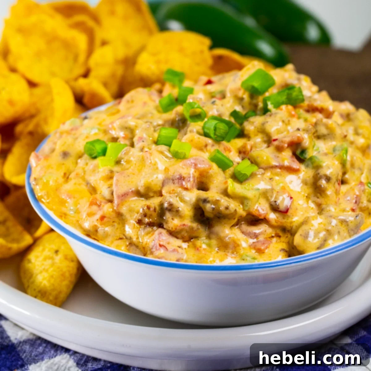 Savory Sausage Pimento Cheese Dip 2 Delicious Sausage Pimento Cheese Dip in a rustic bowl, ready to serve.