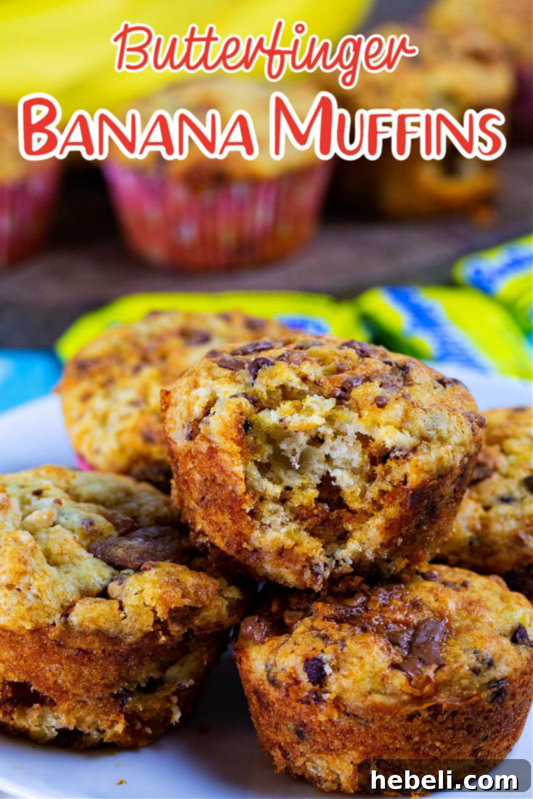 A cluster of golden-brown Butterfinger Banana Muffins presented beautifully on a plate.