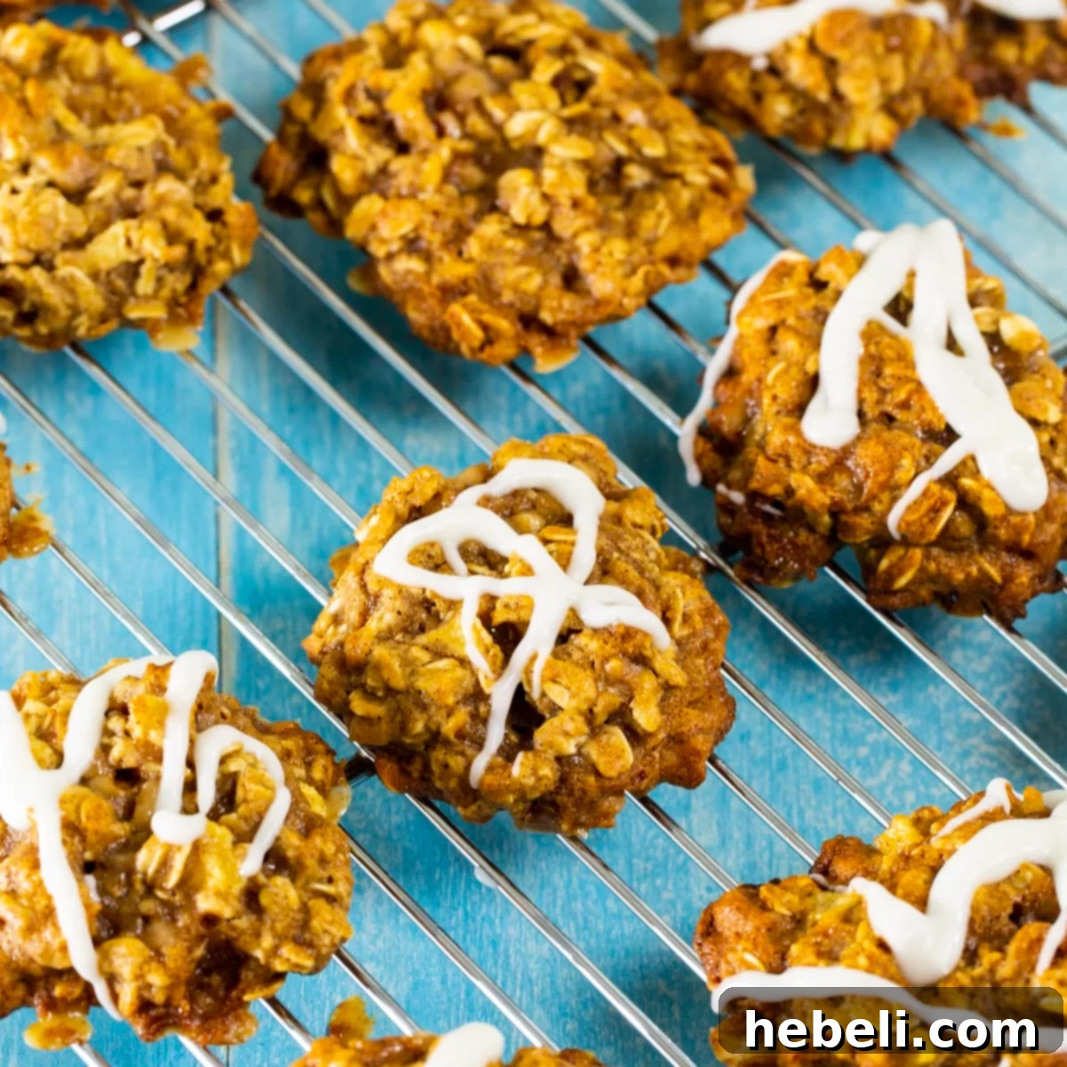 Delicious Apple Toffee Oatmeal Cookies arranged on a wire cooling rack, ready to be enjoyed.