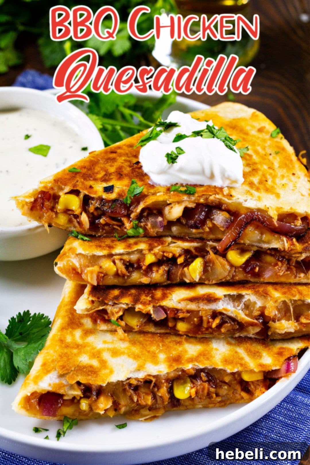 Loaded BBQ Chicken Quesadillas 5 Stacked BBQ Chicken Quesadilla wedges on a plate, ready to be enjoyed.