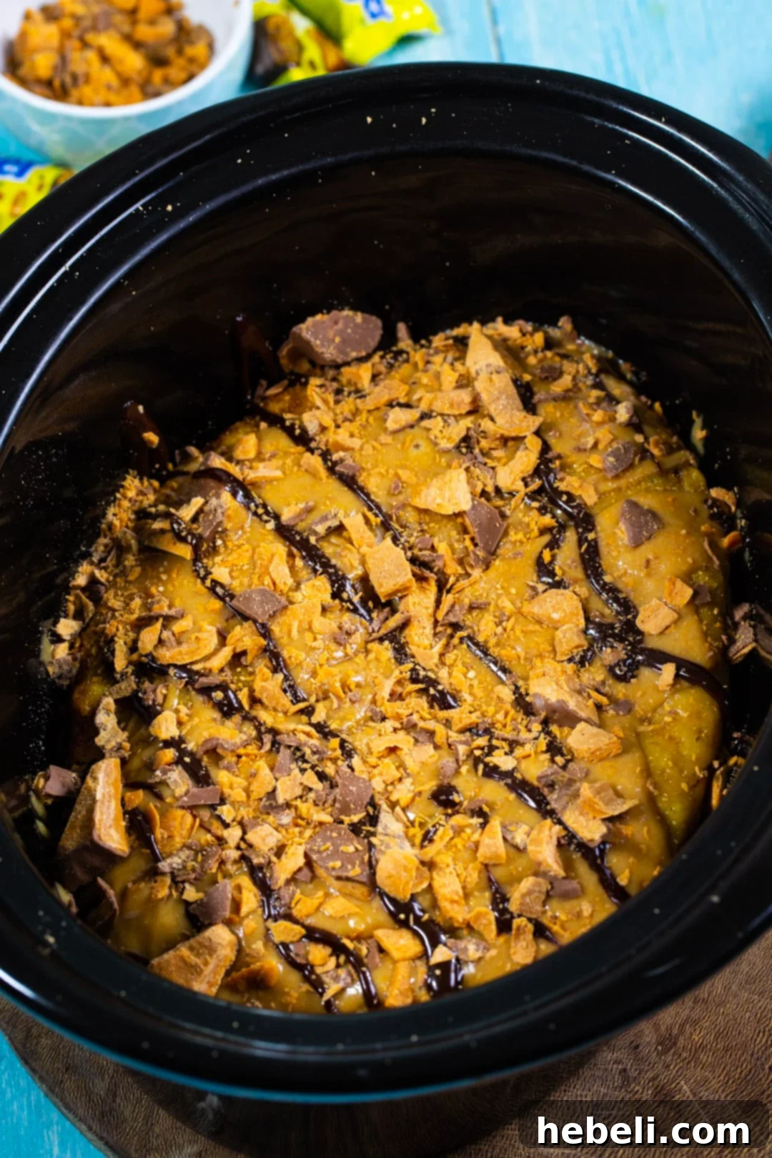 Crock Pot Butterfinger Cake 4 Frosted Slow Cooker Butterfinger Cake in the crockpot, ready to serve.
