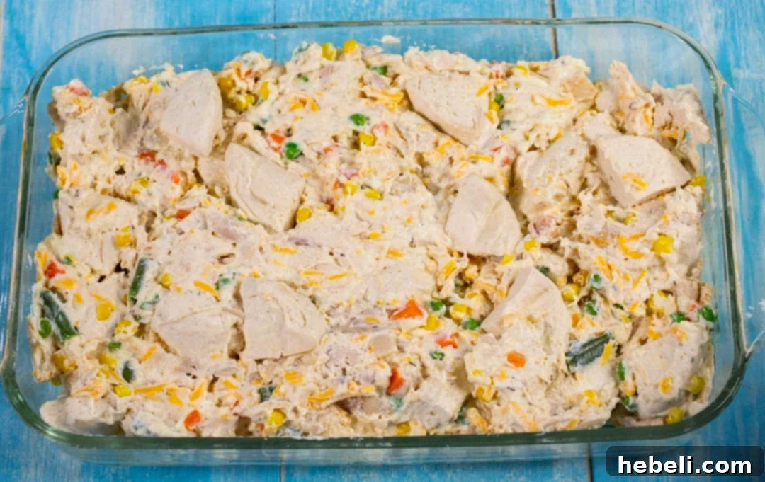 Fluffy-Topped Chicken Pot Pie Casserole 4 The uncooked Chicken Pot Pie Bubble Up mixture in a baking dish, perfectly prepared and ready to go into the oven.