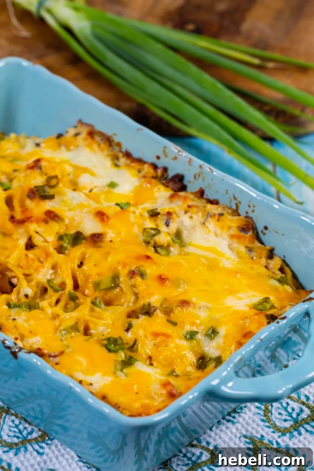 A finished Crack Chicken Spaghetti casserole dish, golden and bubbly, fresh out of the oven.