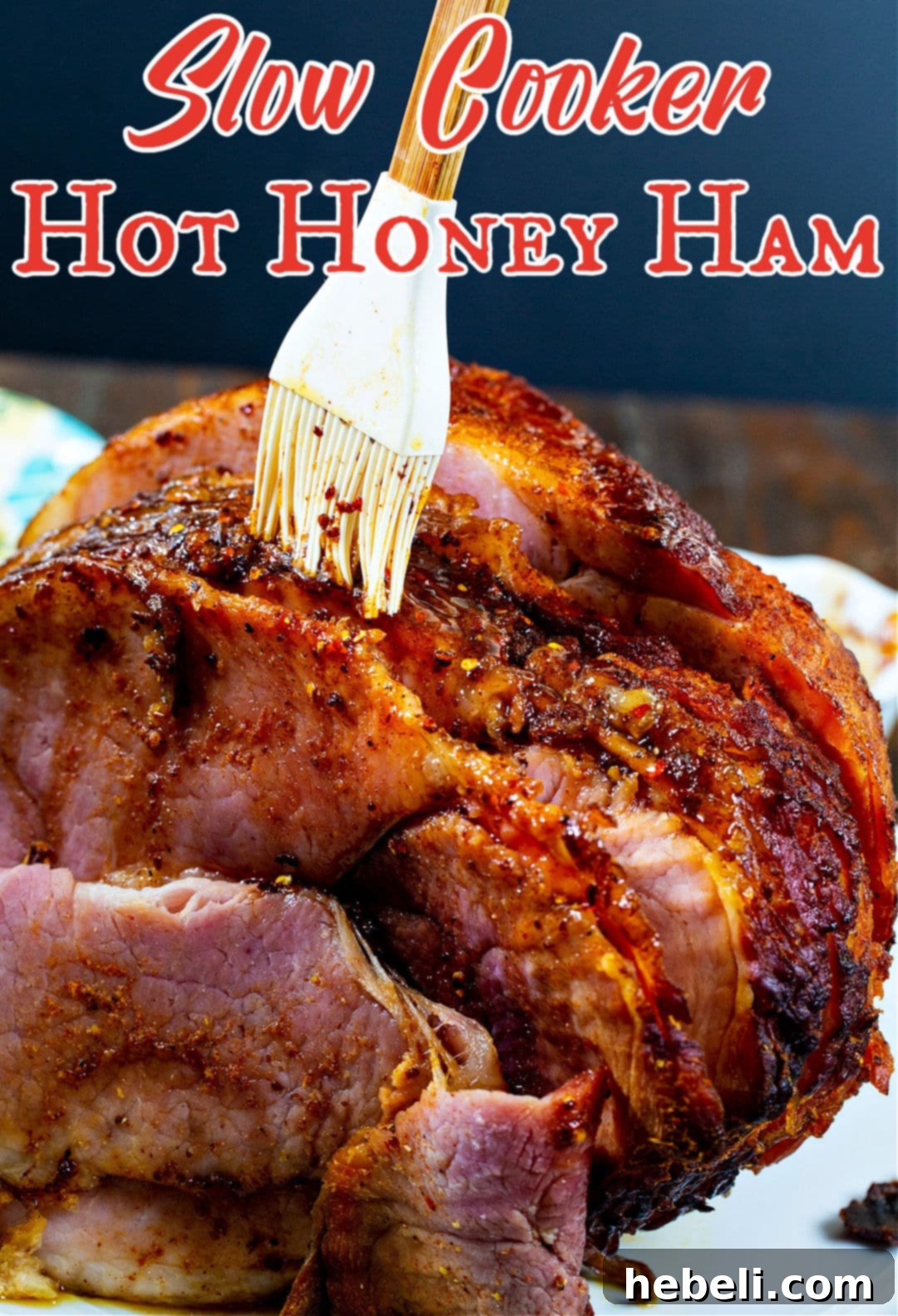 Slow Cooker Hot Honey Glazed Ham 5 Slow Cooker Hot Honey Ham being carefully brushed with its final glaze layer.