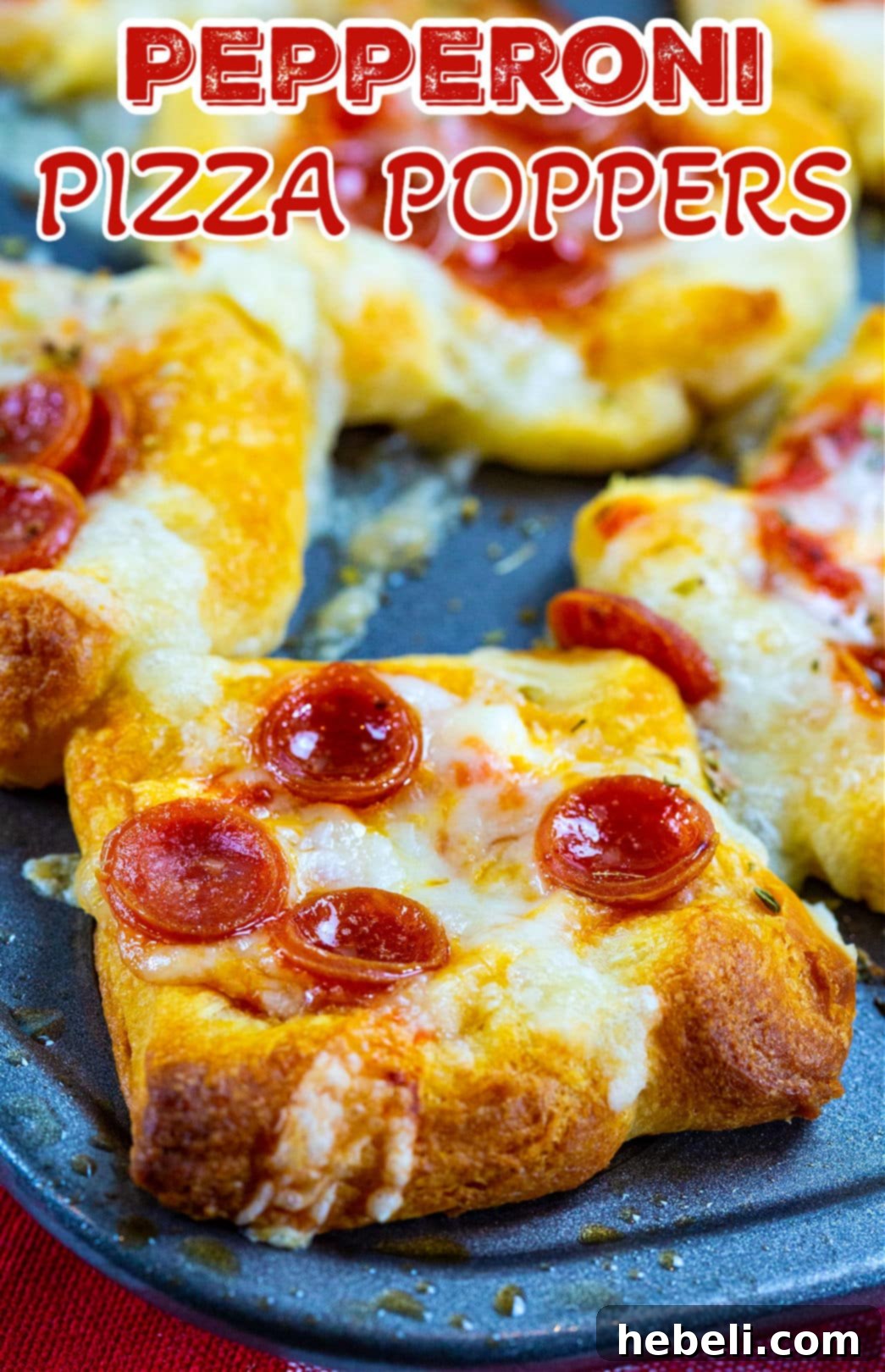 Cheesy Pepperoni Pizza Bites 5 A vibrant close-up of a single Pepperoni Pizza Popper, showcasing the perfectly melted cheese and crispy edges of the pepperoni.