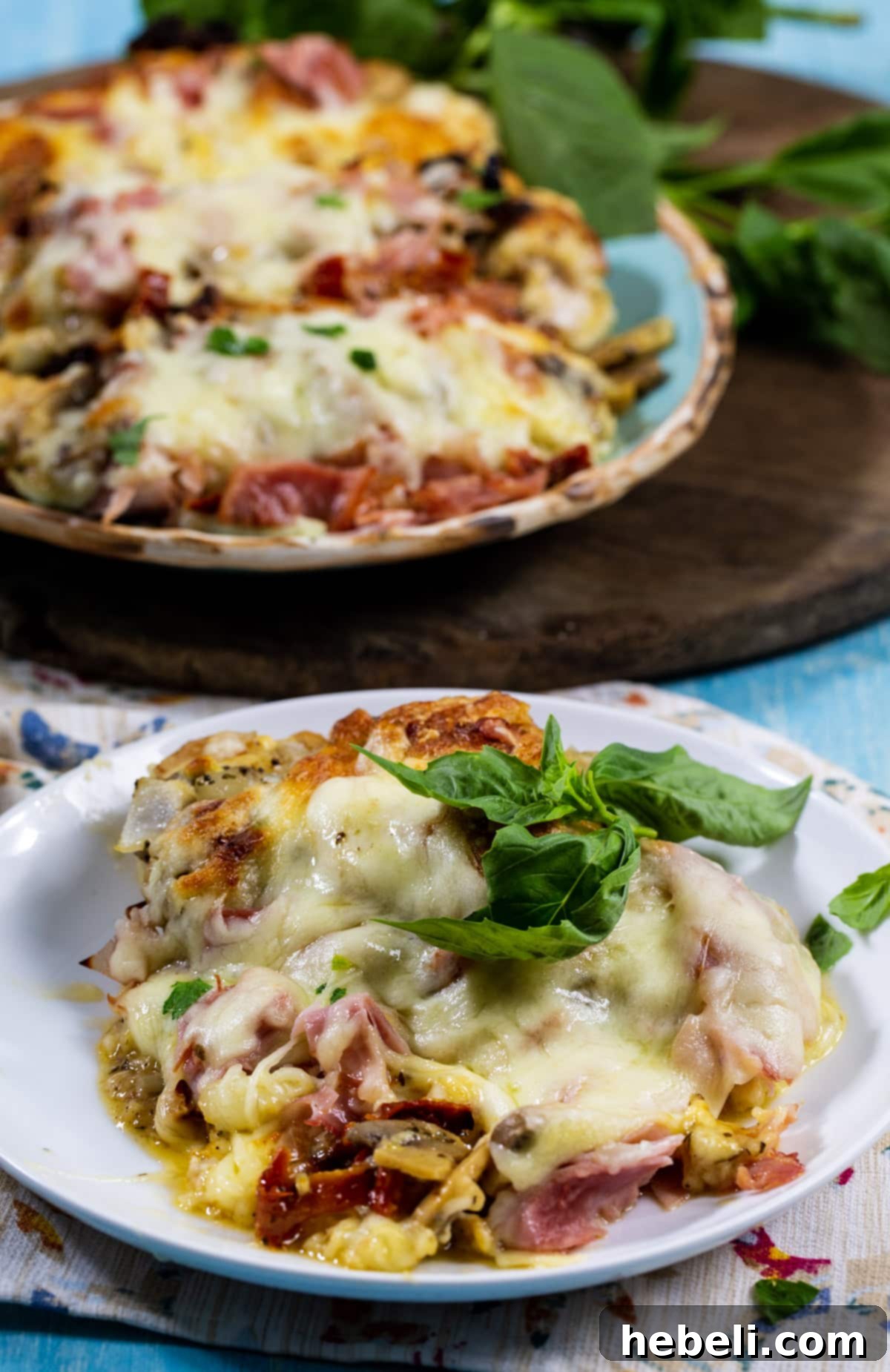 The Company Coop 6 Plated Company Chicken served with a side of steamed green vegetables, ready to eat.