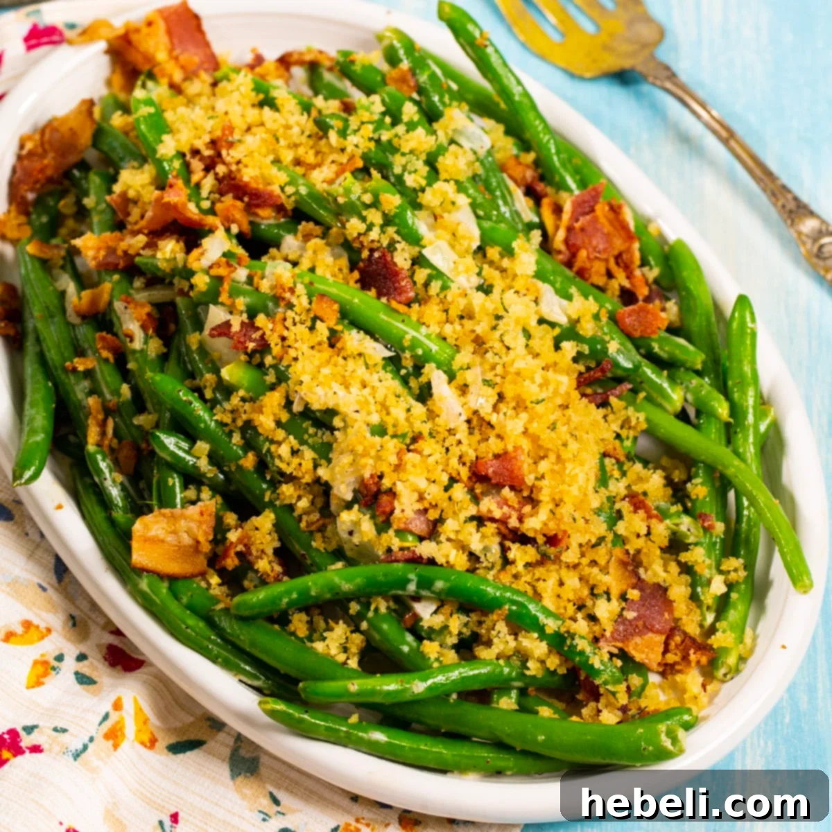 Crispy Bacon Green Beans 2 Green Beans with Bacon Breadcrumbs on a serving plate, showcasing the crispy topping.