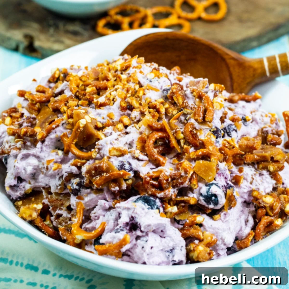 Creamy Blueberry Pretzel Crunch 2 Blueberry Pretzel Fluff in a beautiful serving bowl, garnished with fresh blueberries.
