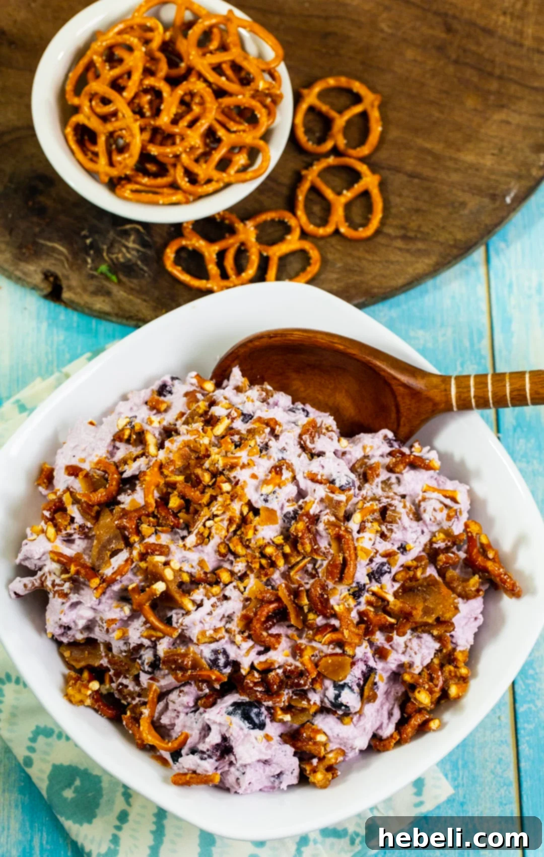 Creamy Blueberry Pretzel Crunch 4 A small bowl of Blueberry Pretzel Fluff, showcasing the vibrant blueberries and crunchy pretzel pieces.