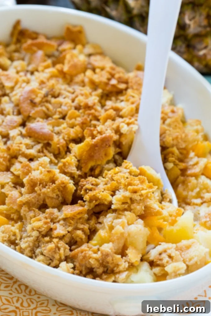 Sweet & Savory Pineapple Bake 2 Pineapple Casserole showcasing its dual nature as both a sweet and savory dish, featuring a golden crust and soft interior.