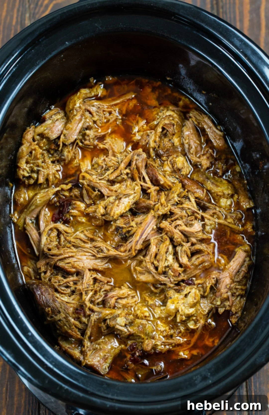 Island BBQ Pork and Mango Quesadillas 3 Pulled Pork simmering in a slow cooker, ready to be shredded.