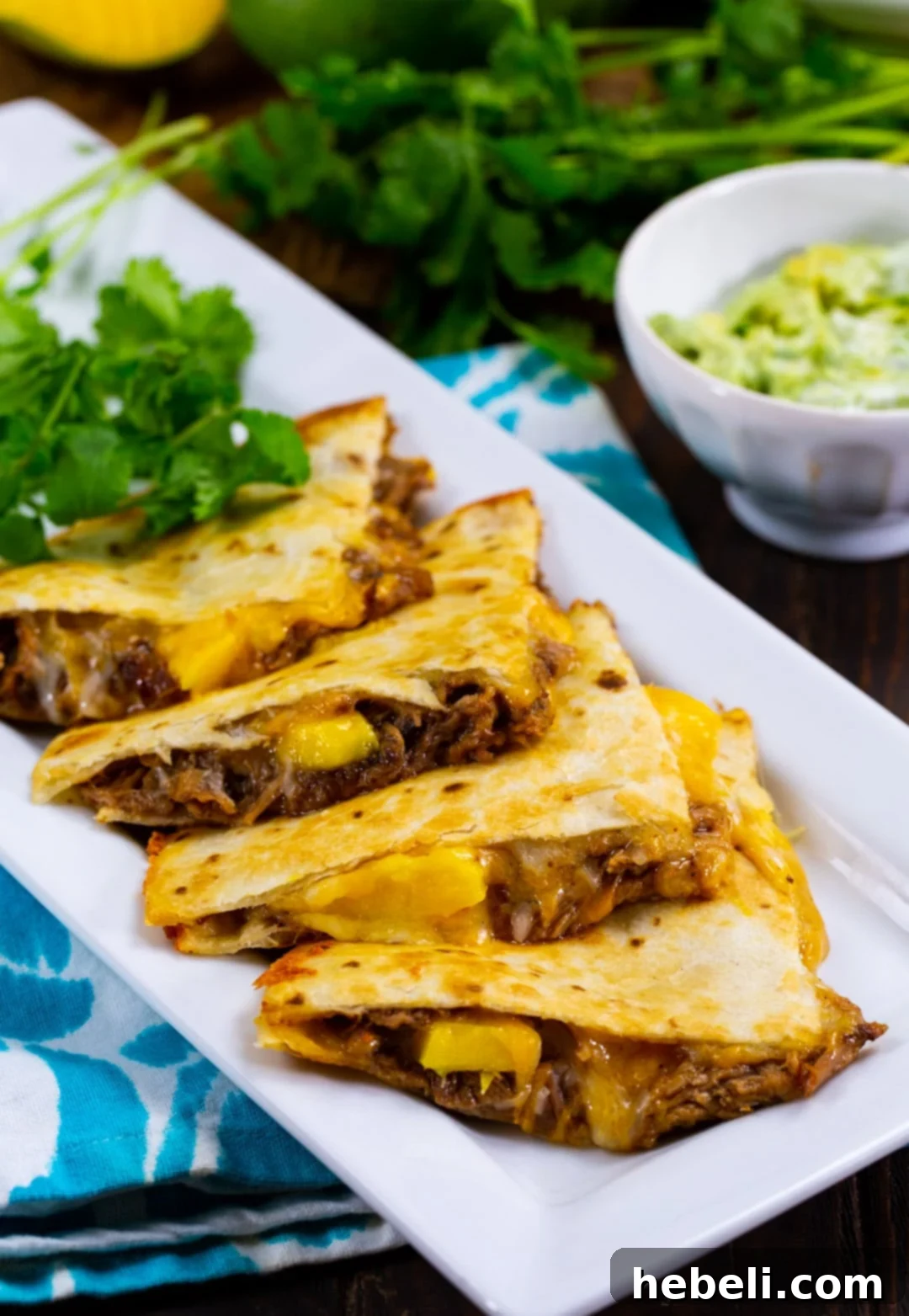 Island BBQ Pork and Mango Quesadillas 6 A large serving platter piled high with BBQ Pork and Mango Quesadillas.