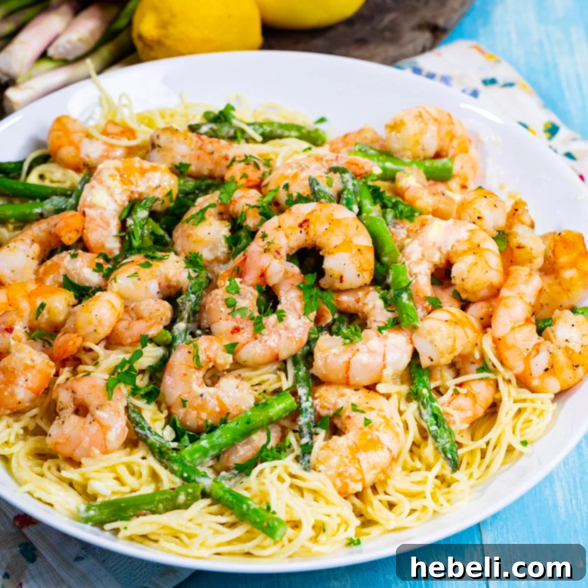 Zesty Lemon Shrimp Pasta 2 Creamy Lemon Shrimp Pasta with Asparagus in serving bowl.