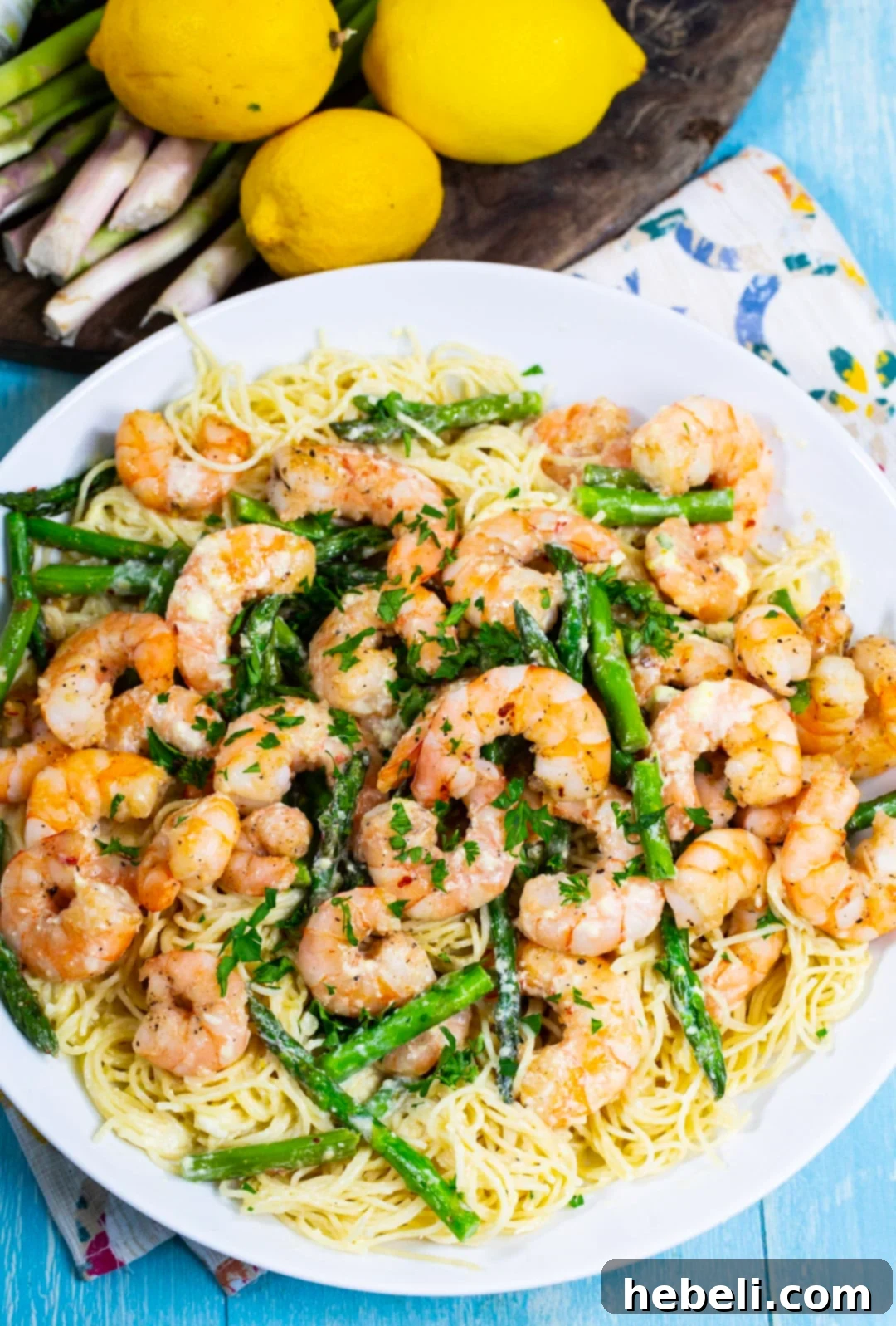 Zesty Lemon Shrimp Pasta 3 Lemon Shrimp and Asparagus Angel Hair Pasta in serving bowl.