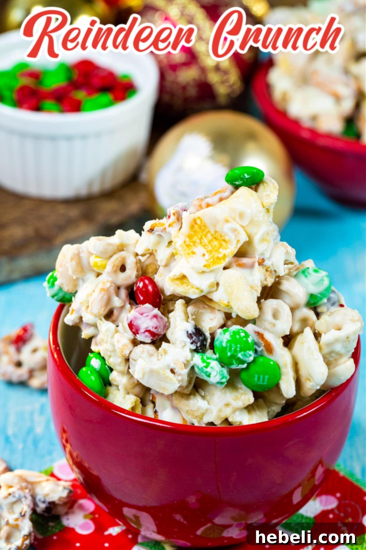 A close-up shot of Reindeer Crunch in a red bowl, highlighting its texture and festive colors.